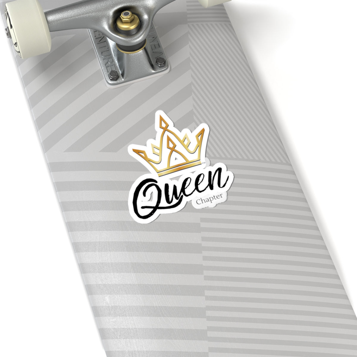 Skateboard with a 'Queen Chapter' sticker on a white background