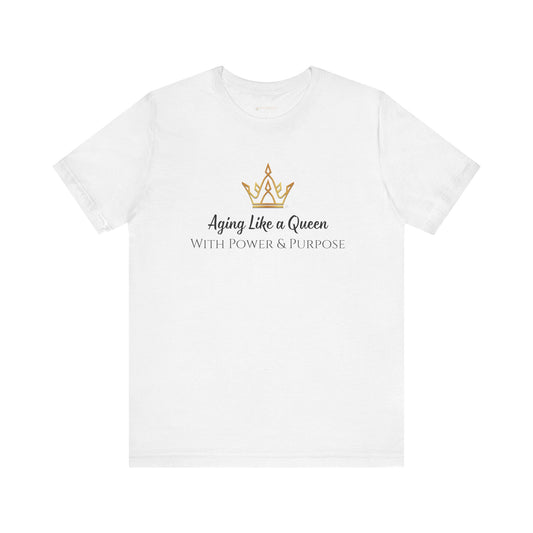 White t-shirt with a gold crown graphic and text on a white background