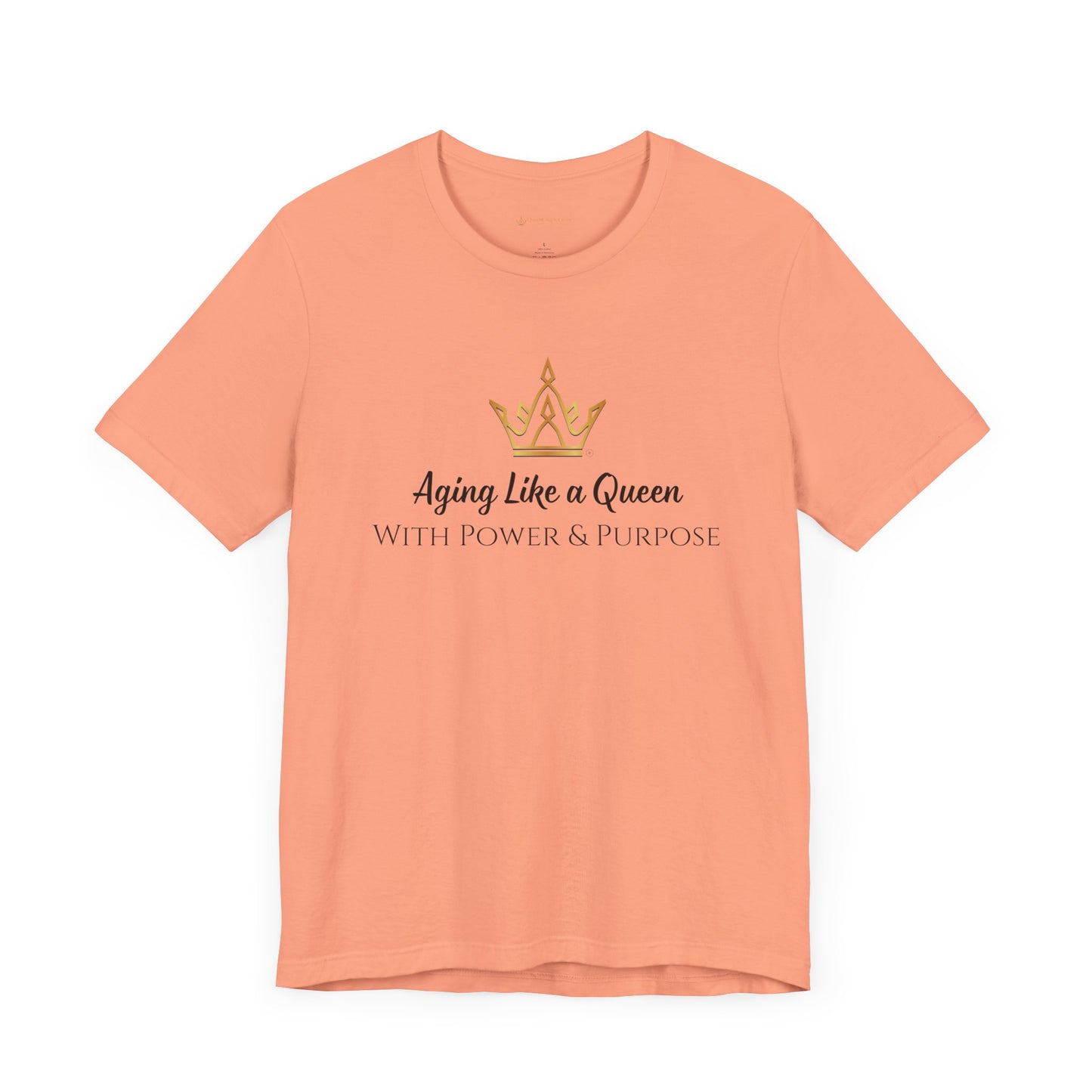 Peach t-shirt with a crown graphic and text on a white background