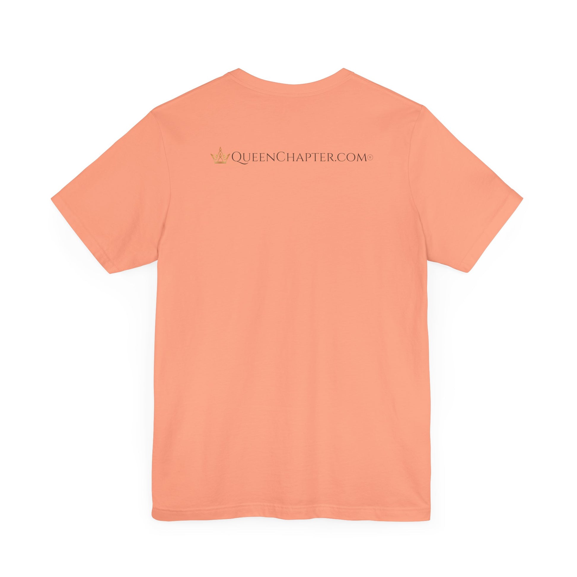 Peach-colored t-shirt with 'Queen Chapter.com' text on the back against a white background