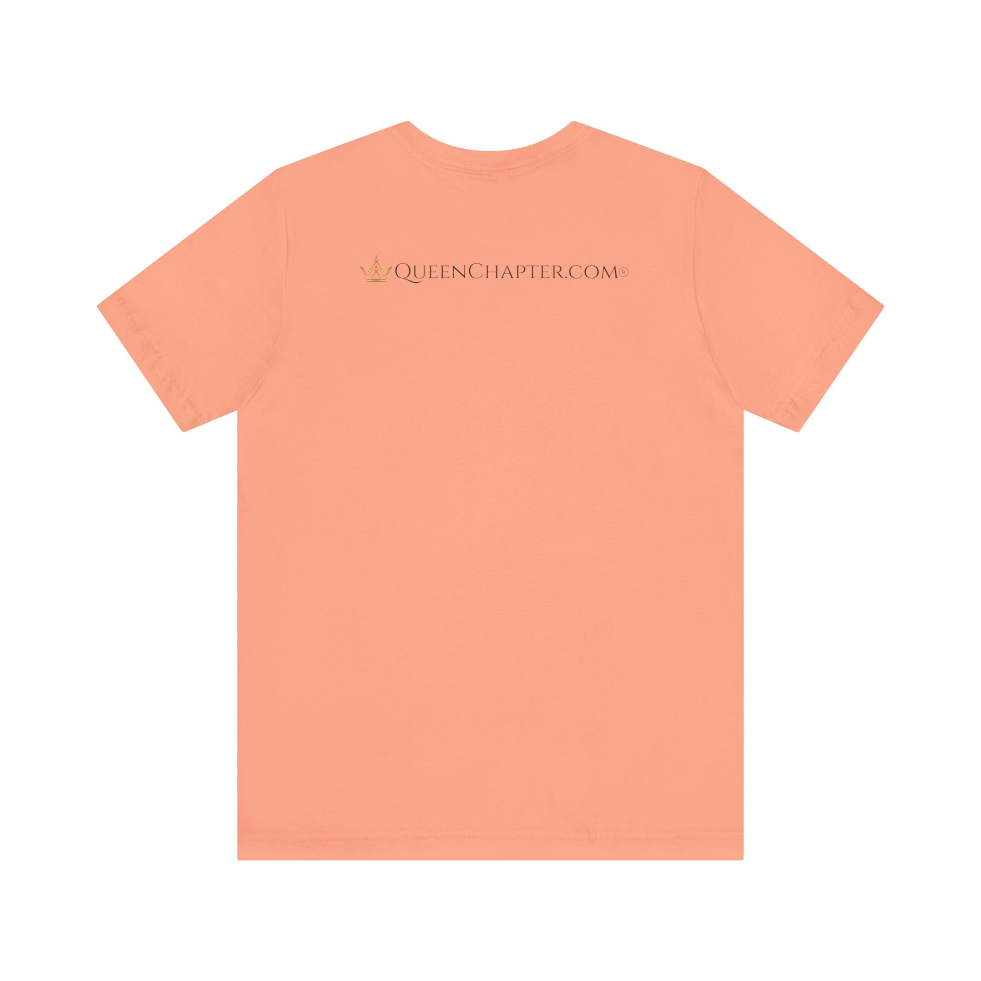 Peach-colored t-shirt with 'QUEENCHAPTER.COM' text on a white background